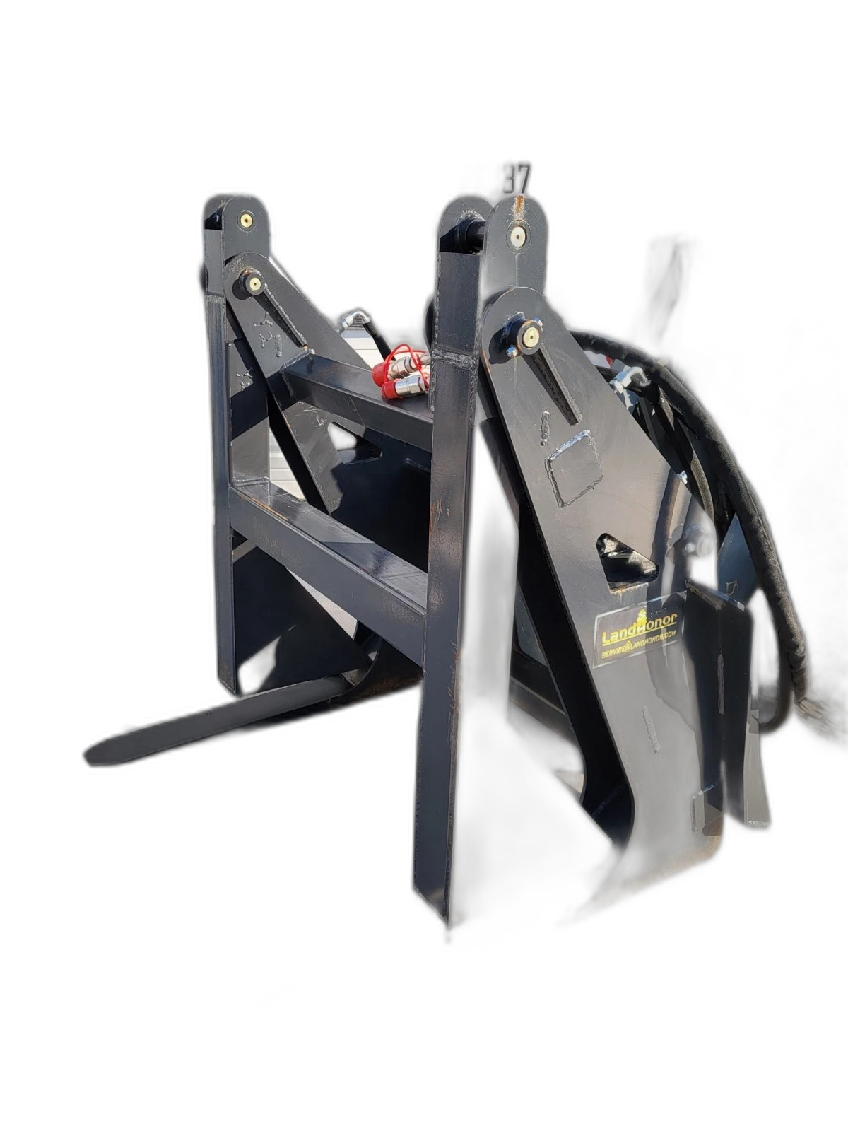 Landhonor log grapple, clamp arms open over the tines, LandHonor decal and red-capped couplers