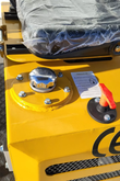 AGT MX12R mini excavator hydraulic oil tank: chrome filler cap, red battery disconnect switch and fill instructions