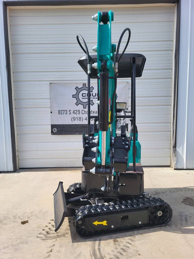 Teal AGT MH12RX mini excavator, boom raised with digging bucket and thumb, backfill blade and rubber tracks