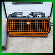 Front of the Arteer concrete mixer: mixing drum behind an orange mesh guard with a gray discharge chute
