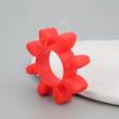 Red 8-lobe jaw coupling spider insert standing on edge