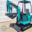 Teal QK16R mini excavator with canopy, open operator seat, rubber tracks, dozer blade and thumb bucket