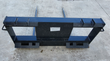 JCT double hay bale spear: black quick-attach frame with two straight tapered tines for round and square bales