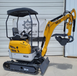 ME20 mini excavator in side profile, yellow boom with bucket and hydraulic thumb, canopy over the seat, rubber tracks