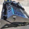 AGT landscape rake with its perforated dump shroud, hydraulic cylinder, tension spring and mounted drive bearings