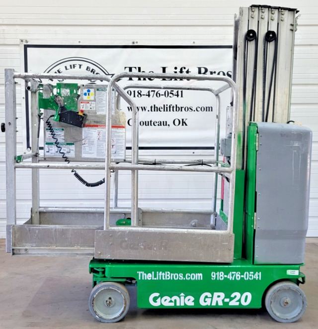 Green Genie GR-20 vertical mast lift, stowed, side view with platform rails and Lift Bros backdrop