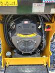 AGT CRT23 739cc gasoline engine with cooling-fan cover, fuel cap and the machine's data plate alongside