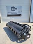 Wolverine 66-inch vibratory roller, side view: black drum housing with square ports, end hydraulic motor