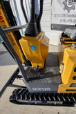 AGT MX12R mini excavator platform: rubber floor mat and travel pedal, booted control levers, hydraulic tank cap