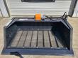 Wolverine 72-inch screening bucket straight on, showing the full width of the mesh screen floor and the support ribs under it.