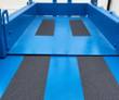 Genie GS-3232 platform deck with anti-slip grip strips and slide-out extension deck between blue guardrails
