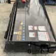 Mower King 72-inch box broom from above: safety decals, hinged hood and skid steer mount plate