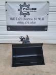 Black 5T hydraulic tilt bucket seen head-on, flat smooth cutting edge and tilt coupler above