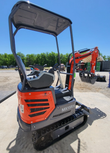 MX15RX mini excavator with black canopy, extended boom and bucket, orange body and rubber tracks