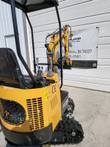 AGT H12R mini excavator vented engine cover, seat and joysticks, with the boom extended over the rubber tracks