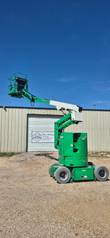 JLG E300AJP boom lift, mast raised and extended, side view