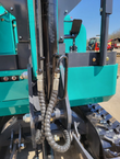 QK16R mini excavator boom base with swing cylinder and two spiral-wrapped auxiliary hydraulic hoses