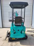 AGT MH12RX mini excavator from behind: canopy roof, operator seat, teal body panels and rubber tracks