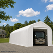 White 30oz PVC dual-truss RV shed, front open with a motorhome parked inside; Inspiration Photo