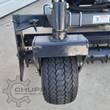 Arteer soil conditioner gauge wheel on its pin-adjustable depth post, with the toothed drum and end plate alongside