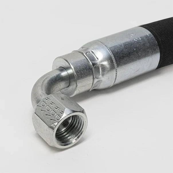Black hydraulic hose end with crimped steel ferrule and 90-degree female swivel fitting