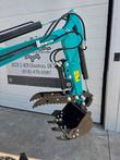 CFG KV16R mini excavator boom, hydraulic thumb attachment and digging bucket, teal arm