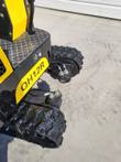 AGT QH12R decal on the yellow body above the rubber tracks and hydraulic final-drive motors