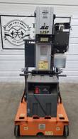 Rear of the JLG 12SP mast lift: mast, hydraulic reservoir and battery box with an 8A battery charger