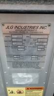 JLG 12SP data plate: serial 0900020692, model year 2003, 500 lb capacity, 12 ft platform height, 12 V DC