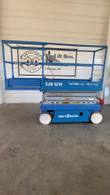 Blue Skyjack SJIII 3219 scissor lift, stowed, side view with the platform extension slid out