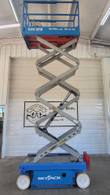 Skyjack SJIII 3219 scissor lift raised to full height, platform underside and scissor stack