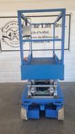 Skyjack SJIII 3219 scissor lift, stowed, end view of platform deck, control box and scissor stack