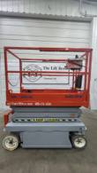Orange and gray Skyjack SJIII 3219 scissor lift, fully lowered, side view with platform guardrails and control box