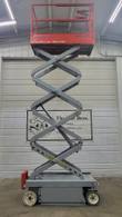 Skyjack SJIII 3219 scissor lift with the platform raised to full height, side view of the extended scissor stack