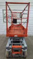 Skyjack scissor lift lowered, end view of the platform entry with chain gate, control box and orange access step