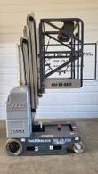 JLG 20MVL mast lift with the platform partly raised, side view of the telescoping mast