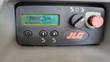 JLG 20MVL ground control display reading 243.3 hours, with key switch and emergency stop