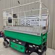 JLG 3246ES electric scissor lift, green and silver, stowed, 3/4 end view with control box