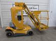 Yellow Haulotte Star 26J mast lift, stowed, side view with jib and caged platform