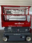 Skyjack 3219 scissor lift stowed, side view with inspection decal on the scissor arm
