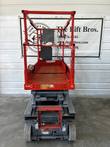 Skyjack 3219 scissor lift stowed, opposite end view with platform deck, entry step and battery charger