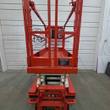 Snorkel S3219E scissor lift end view, platform entry gate, rails and base, stowed