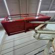 Underside of the raised orange Snorkel S3219E platform on white scissor arms