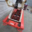 Snorkel S3219E chassis with battery tray open, wiring and cells between the scissor arms