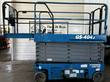 Genie GS-4047 scissor lift stowed, side view with the platform deck extension slid out