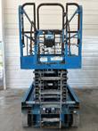 Genie GS-4047 scissor lift stowed, end view with entry steps, platform and capacity instruction decals