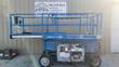 Blue Genie GS3369 RT 4x4 rough terrain scissor lift, platform stowed, left side view with guardrails and tires