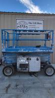 Blue Genie GS3369 RT 4x4 scissor lift stowed, opposite side view with platform, scissor arms and rough terrain tires