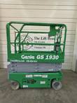 Green Genie GS-1930 electric scissor lift, side view, stowed with platform guardrails