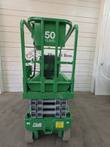 Green Genie GS-1930 scissor lift from the rear, stowed, platform gate and gray scissor stack
